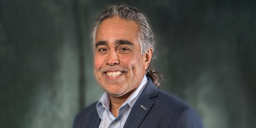 professional headshot of Carlos Romero