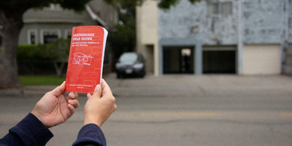 Person holding an Earthquake Field Guide