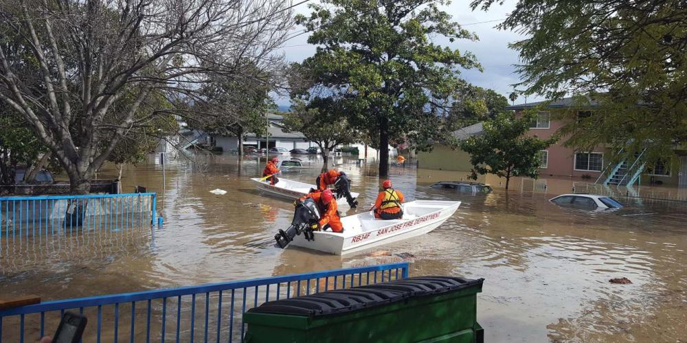 San Jose Fire Department boat in flooded residential neighborhood