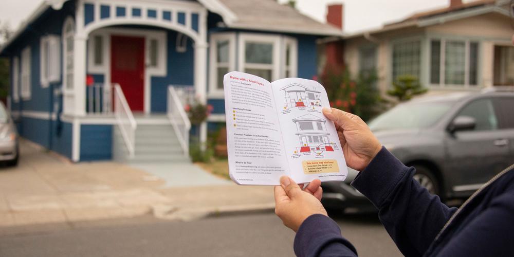 Person holds up home quake quiz guide